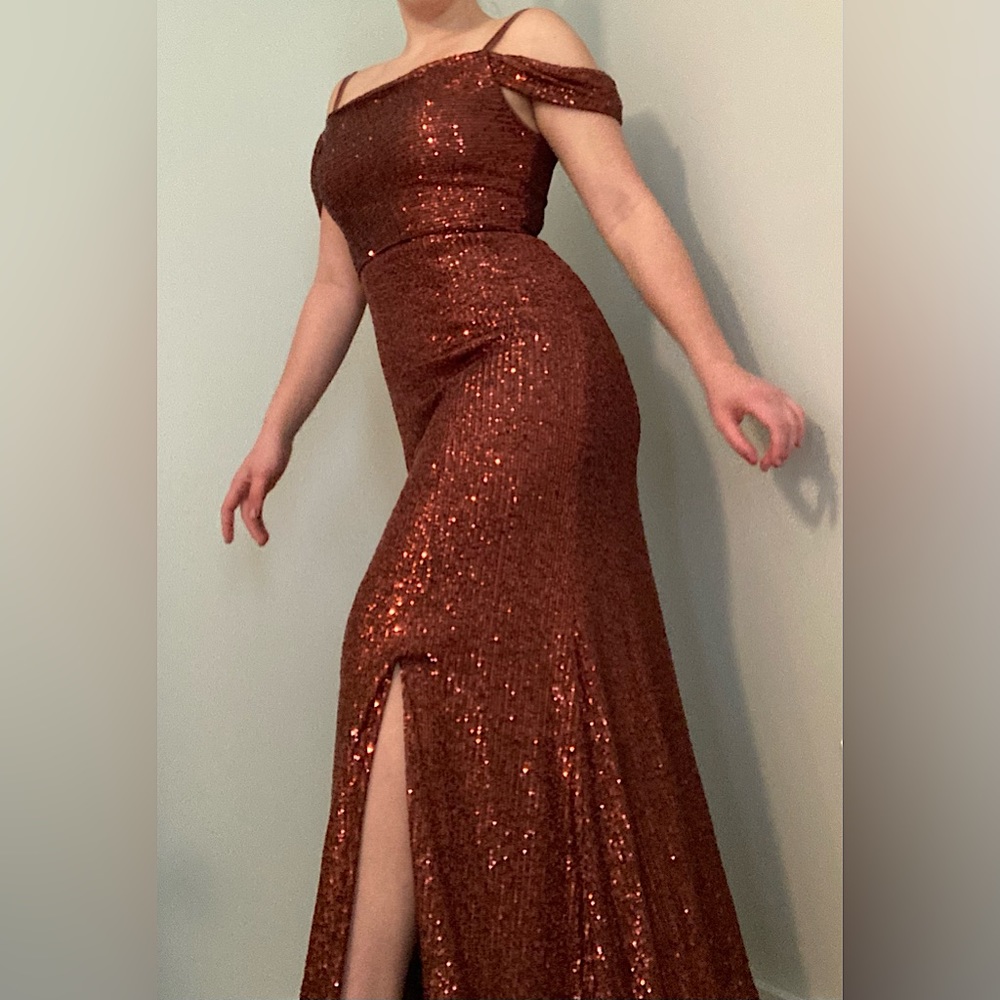 This night way dress, is beautifully sparkly and perfect for any formal event.